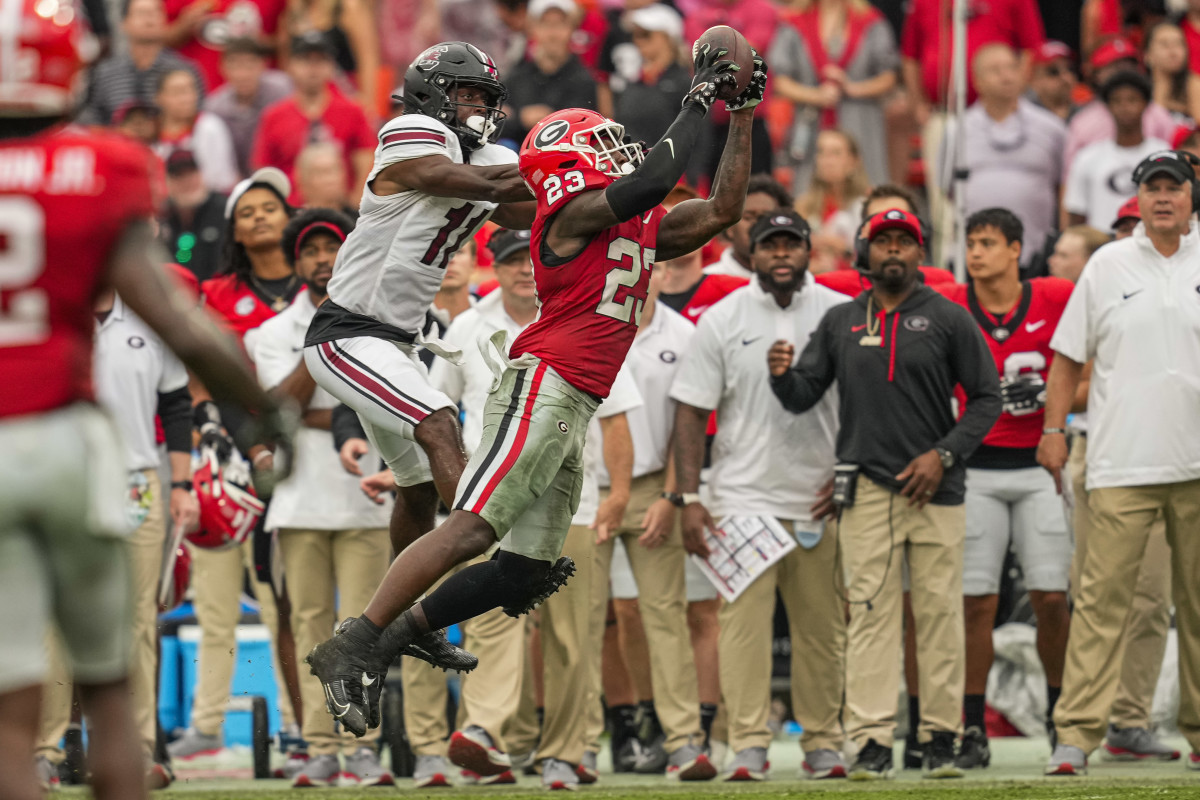 Sep 16, 2023; Athens, Georgia, USA; Georgia Bulldogs defensive back Tykee Smith (23) intercepts a pass in front of South Carolina Gamecocks wide receiver Eddie Lewis (11) during the second half at Sanford Stadium. Mandatory Credit: Dale Zanine-USA TODAY Sports  